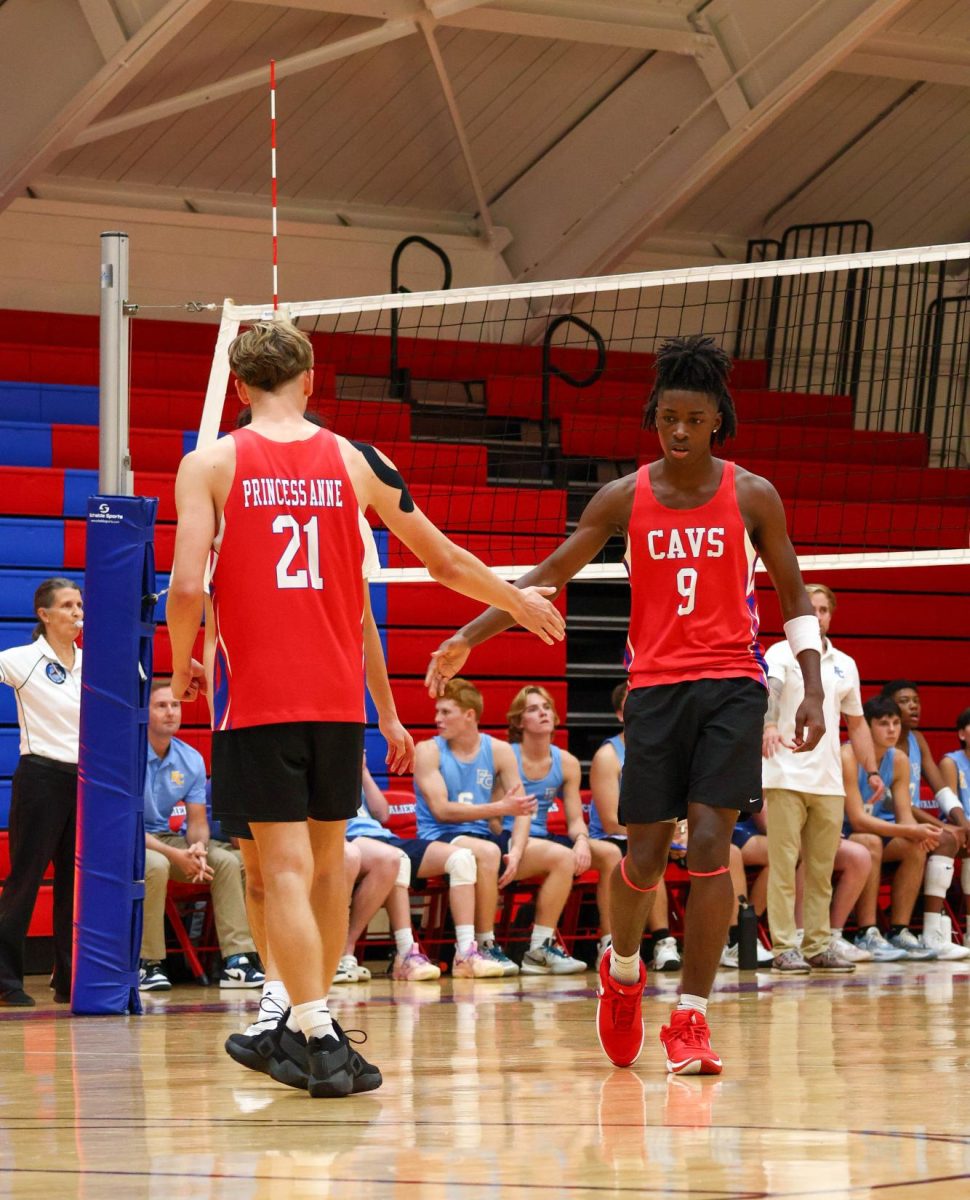 Seniors Maciej Majcherczyk and Amari Hoggard celebrate after a point during their September 17 game against First Colonial. 