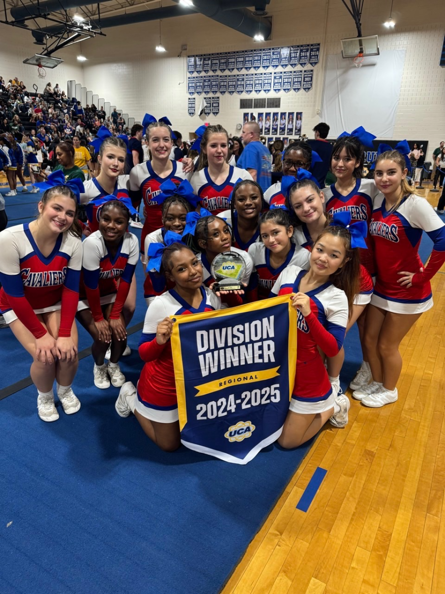 The PAHS Cheer team standing with their Division Winner awards at the competition 