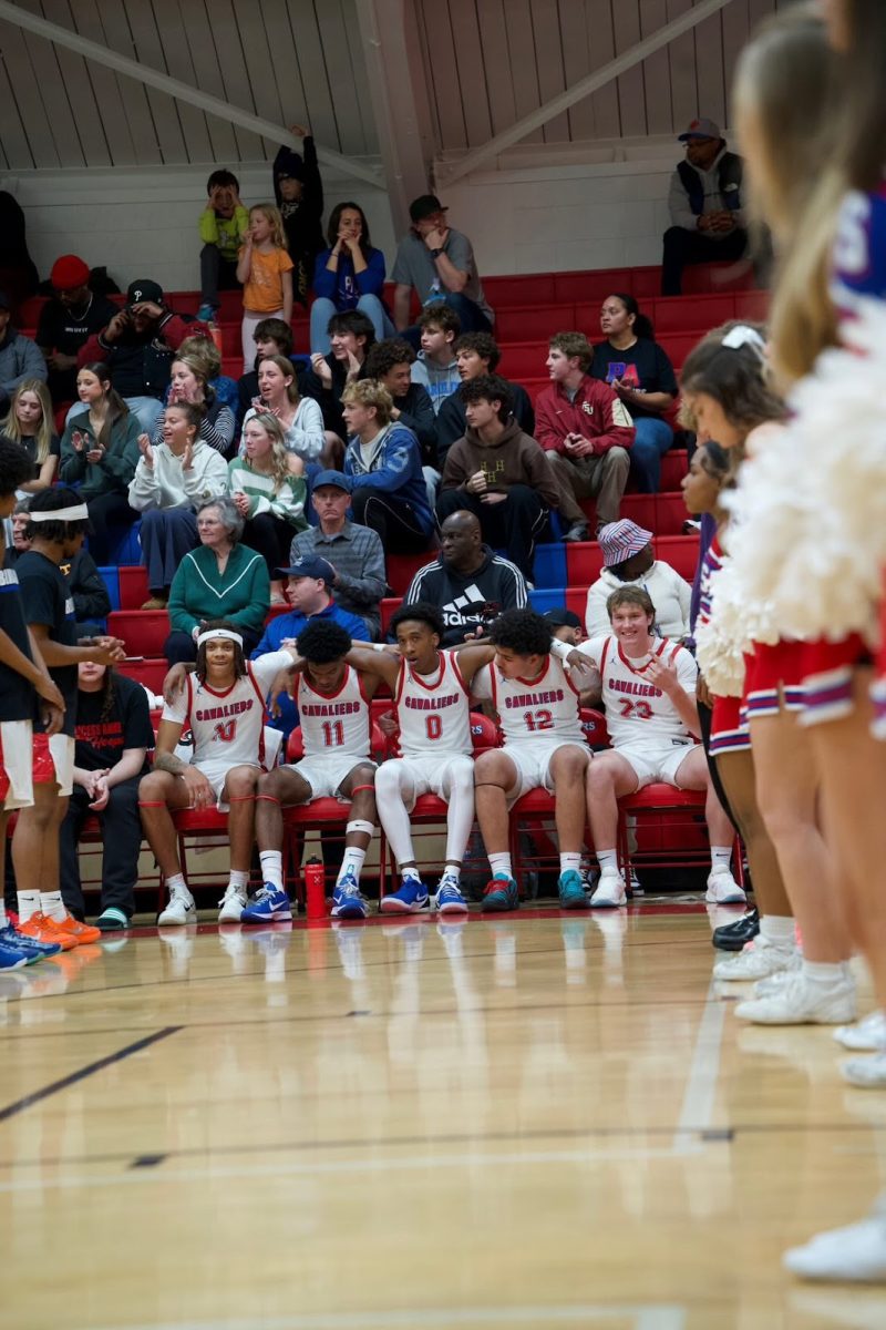 PA Boys Basketball starting lineup sits on the bench before home game.